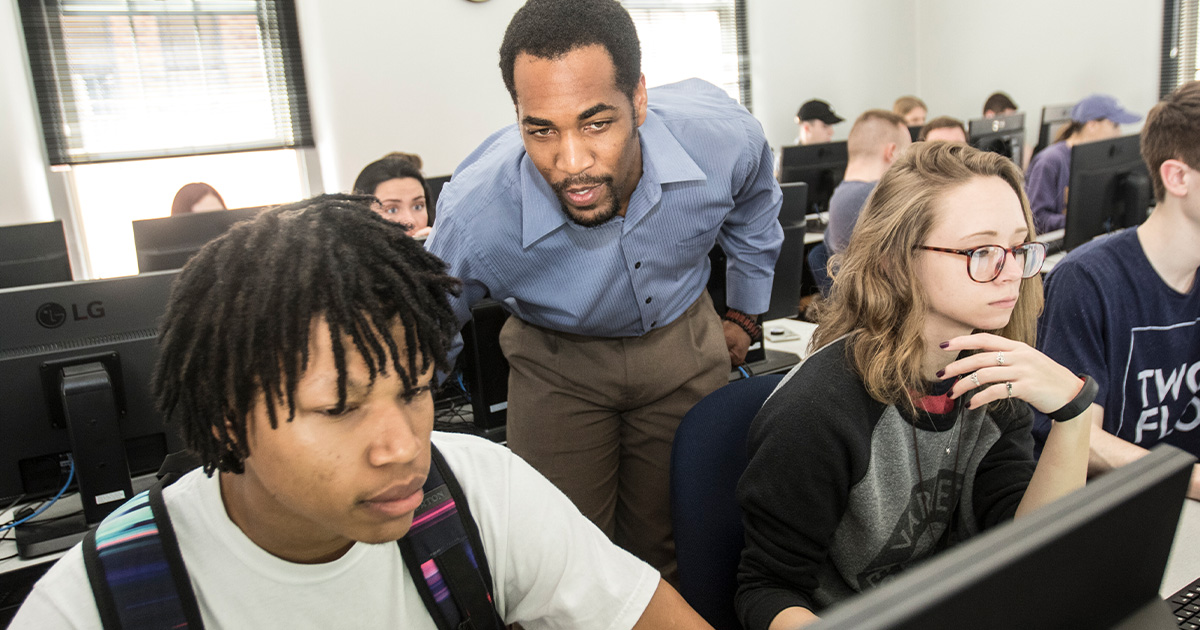Dr. Mario Mighty guides students through their online classwork in his Geography class.