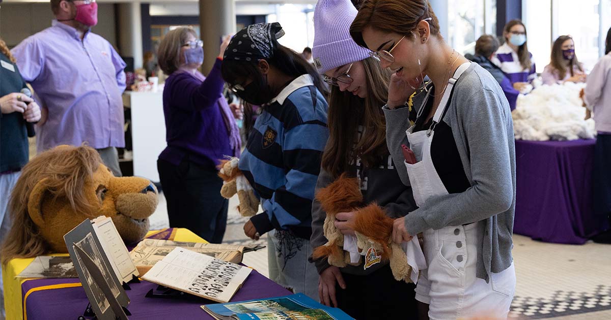 Students look at historical images of campus during the Stuff-A-Lion event at UNA Founders' Day 2022.