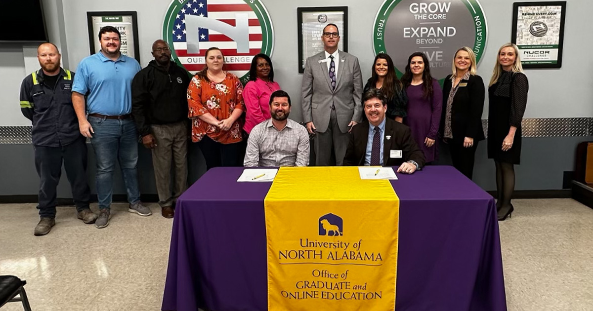 University of North Alabama representatives as well as those from the Nucor facility in Decatur participate in a signing ceremony for a learning agreement that will benefit Nucor team members.