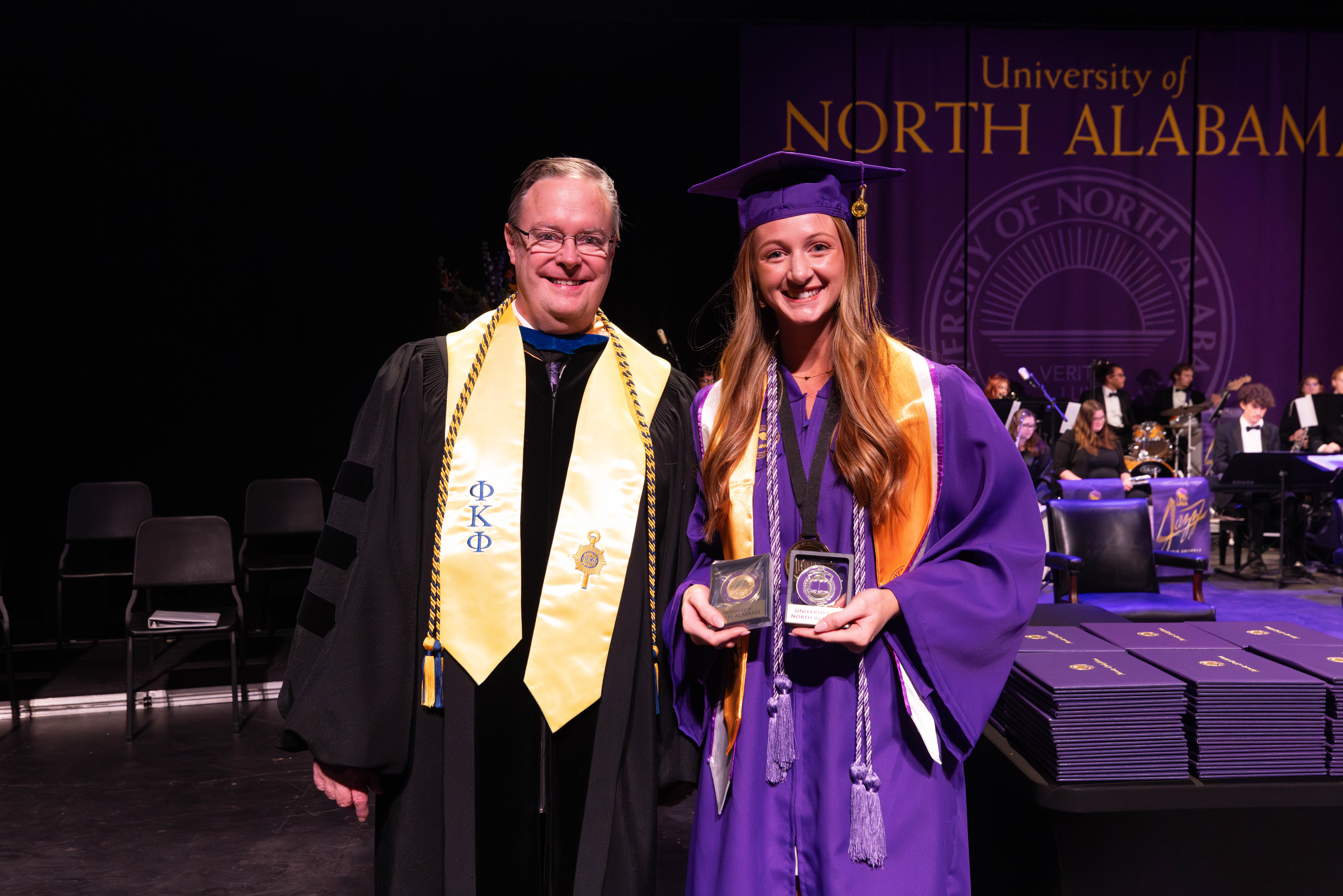 Alexis Marie Homer is one of the seven Keller Key recipients at the Fall 2024 commencement ceremonies at the University of North Alabama. Provost and Executive Vice President for Academic Affairs Dr. Brien Smith presented her with her award.