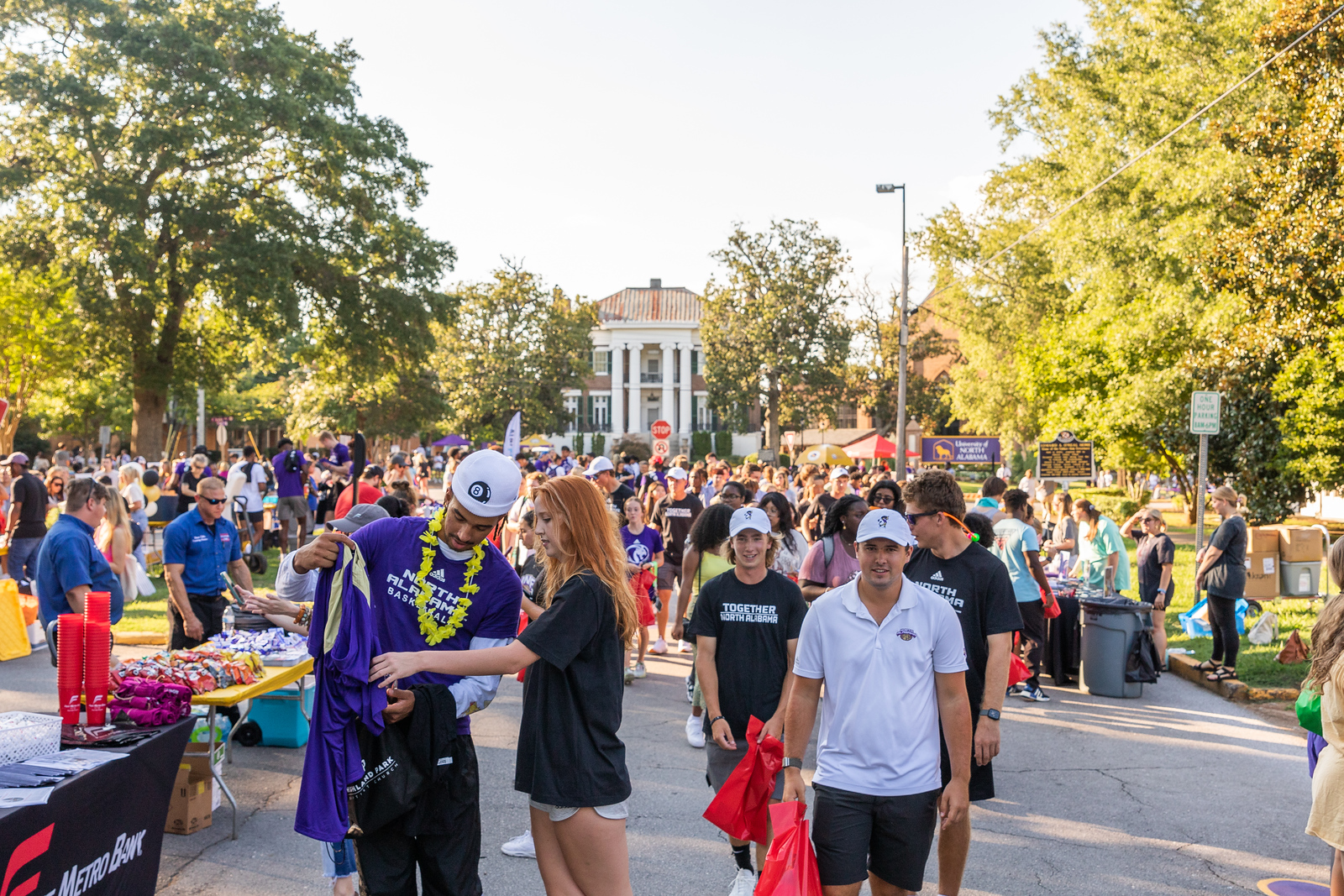 SOAR Counselor and Alumni Relations dipping their pencils in Harrison Fountain